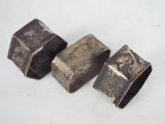Three silver napkin rings, one with engine turned decoration, Birmingham assay 1956,