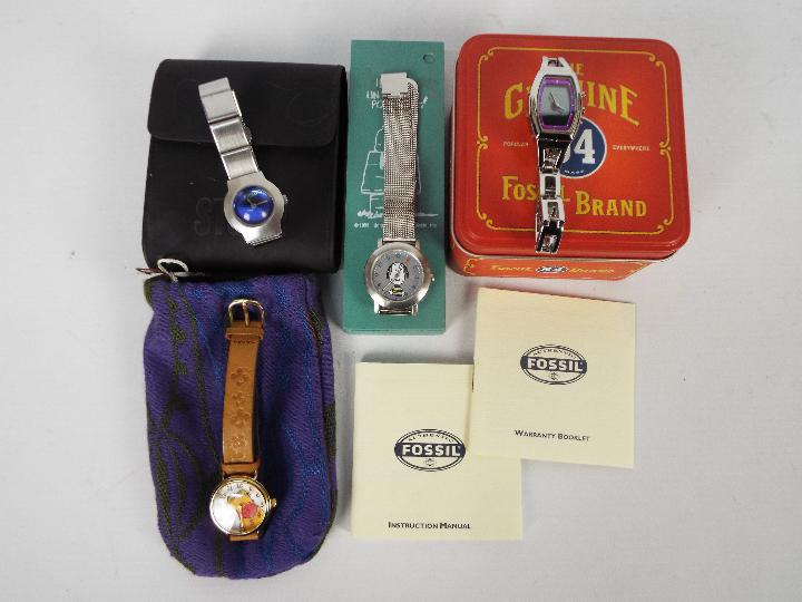 A collection of watches to include an Opex Snoopy watch, Timex Winnie The Pooh and similar.