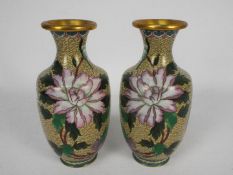 A pair of cloisonne vases decorated with flowers and birds, approximately 20 cm (h).