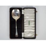 A large George VI silver spoon in fitted case, Birmingham assay 1945, approximately 69 grams / 2.