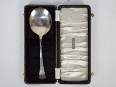 A large George VI silver spoon in fitted case, Birmingham assay 1945, approximately 69 grams / 2.