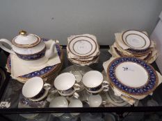 A quantity of Minton tea wares in the Barchester pattern, approximately 45 pieces.