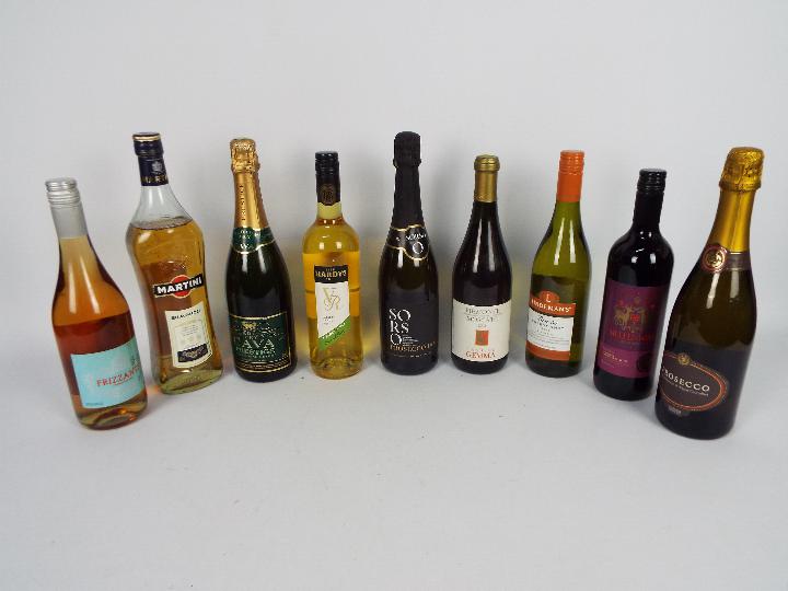 Nine bottles of drink to include wine, Martini Bianco and similar.