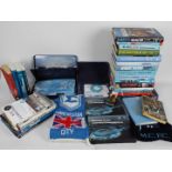 A collection of publications relating to Manchester City Football Club, season ticket packs, scarf,