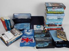 A collection of publications relating to Manchester City Football Club, season ticket packs, scarf,
