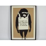 Banksy - A framed limited edition screen print on paper entitled Laugh Now,