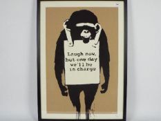 Banksy - A framed limited edition screen print on paper entitled Laugh Now,