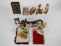 A mixed lot to include vesta case, matchbox covers, brass models of ducks,