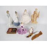 A collection of figurines comprising two Nao, one Wedgwood, one Royal Worcester and one Coalport,