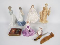 A collection of figurines comprising two Nao, one Wedgwood, one Royal Worcester and one Coalport,