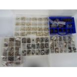 A quantity of jewellery crafting items, white metal charms / pendants contained in five cases.