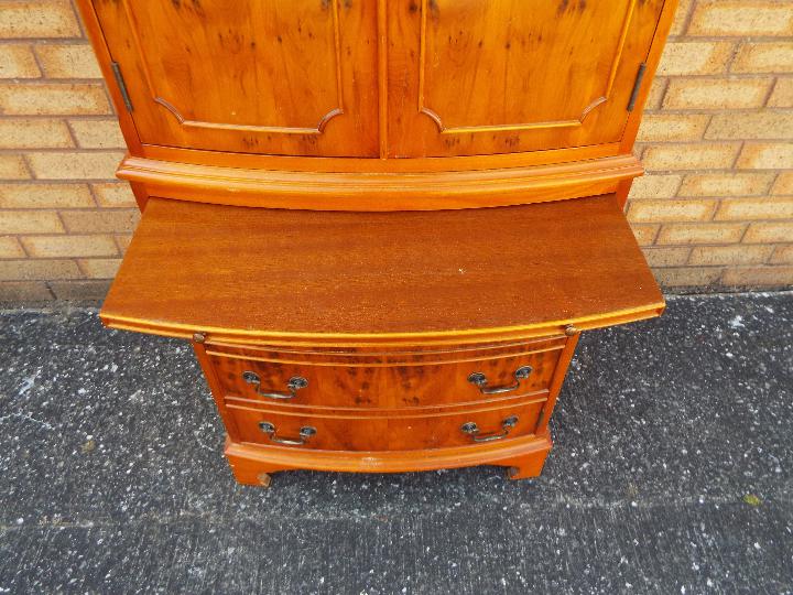 A tallboy cupboard over chest with twin door upper section over four drawers, - Image 4 of 4