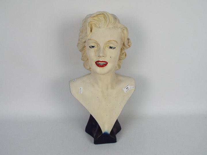 A large head and shoulders bust depicting Marilyn Monroe,