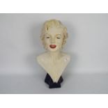 A large head and shoulders bust depicting Marilyn Monroe,