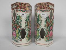 A pair of Chinese ceramic hat stands of hexagonal section,