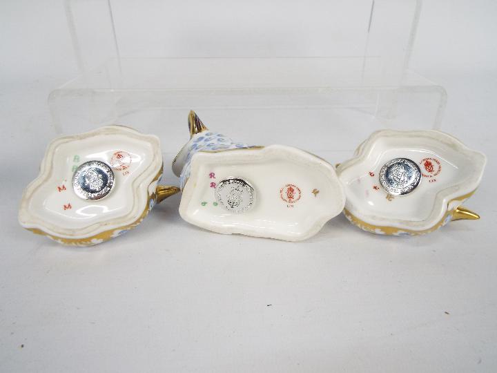 Royal Crown Derby - A collection of paperweights, all with silver stoppers to include a Spaniel, - Image 5 of 5