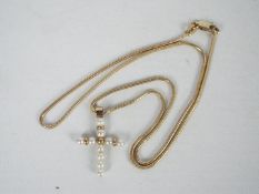 A 9ct gold and pearl crucifix pendant on 9ct gold necklace, 44 cm (l), approximately 4.