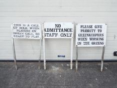 Three metal golf-course signs depicting rules.