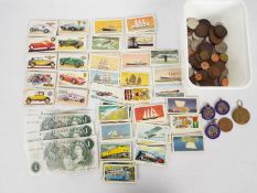Lot to include a quantity of coins and banknotes,