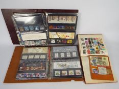 Philately - Two binders containing a quantity of Royal Mail mint stamp presentation packs,
