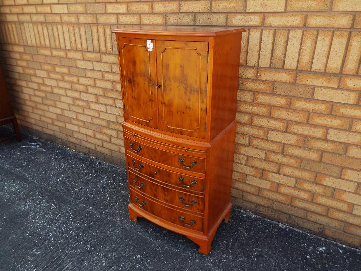 A tallboy cupboard over chest with twin door upper section over four drawers, - Image 2 of 4