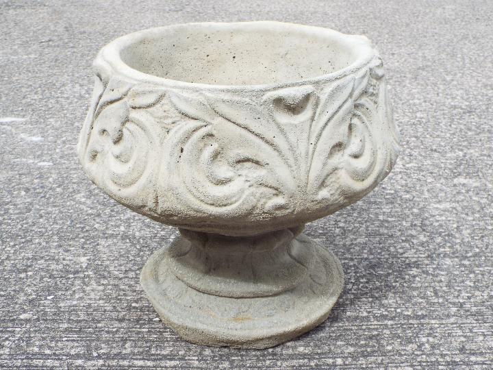 Garden Stoneware - A reconstituted stone fleur-de-lis urn.