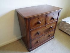 A mahogany chest of two over two drawers, bun handles,