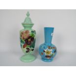 Two glass vases with hand painted floral decoration, largest approximately 27 cm (h).
