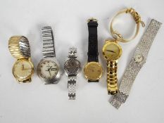 A collection of wrist watches to include Gucci, Bulova, Raymond Weil,