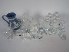 A collection of glass and Swarovski style crystal ornaments and a Wedgwood Jasperware jug.