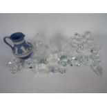 A collection of glass and Swarovski style crystal ornaments and a Wedgwood Jasperware jug.