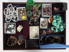 A collection of costume jewellery to include necklaces, bracelets, brooches and similar.