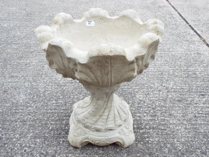 Garden Stoneware - A reconstituted stone urn of tulip form on hexagonal base