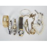 A collection of lady's watches to include a Murano glass example,