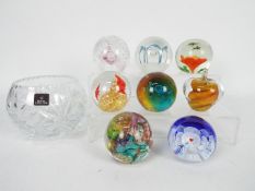 A collection of paperweights to include Caithness,