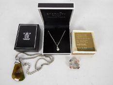 Lot to include an Eternity white metal necklace and pendant set with genuine Swarovski crystal,