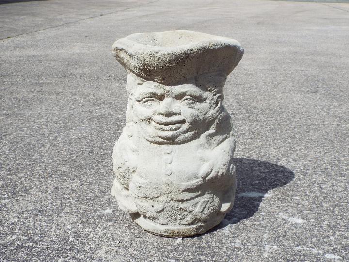 Garden Stoneware - A reconstituted stone planter in the form of a Toby jug.