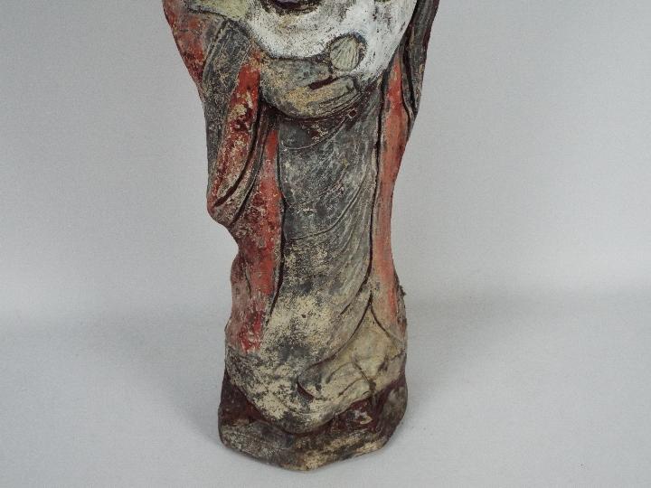 A reconstituted stone garden ornament depicting a Chinese gentleman in flowing robes holding a fish, - Image 3 of 3