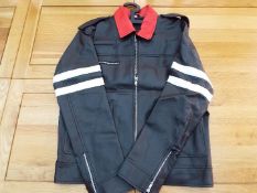 A red, white and black faux leather zip front jacket, size L,