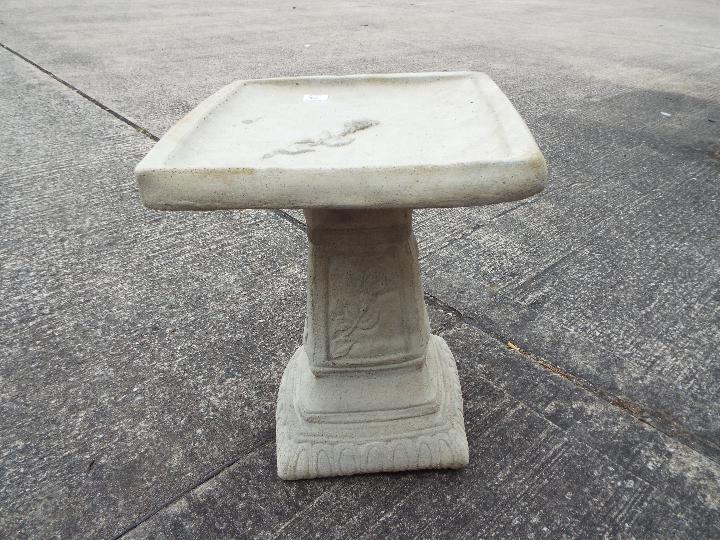 Garden Stoneware - A reconstituted stone bird bath with square top and rose decoration