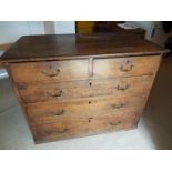 A Victorian oak two over three chest of drawers, brass drop handles,