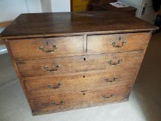 A Victorian oak two over three chest of drawers, brass drop handles,