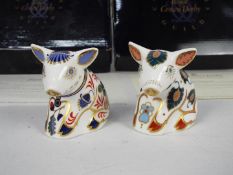 Royal Crown Derby - Two boxed piglet paperweights comprising Collectors Guild Snuffle and Sitting