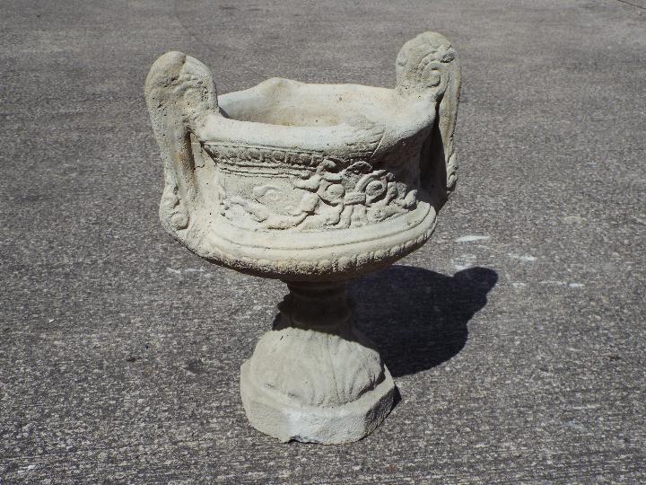 Garden Stoneware - A large reconstituted stone twin handled urn.