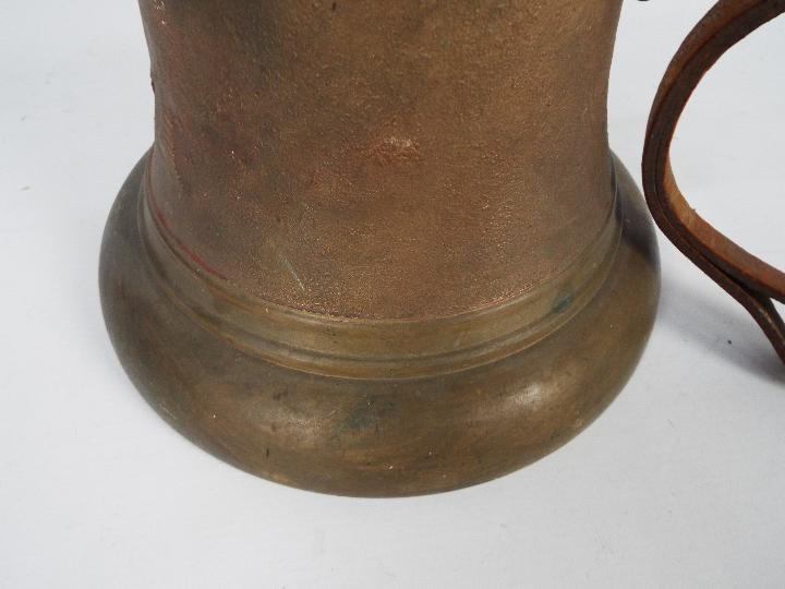 A large cast brass and iron bell, approximately 21 cm (h) and two decorative lustre jugs. - Image 2 of 4