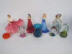 Ceramic figurines to include Lladro and Royal Doulton and a collection of glass paperweights and a