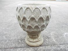 Garden Stoneware - A large reconstituted stone dahlia petal urn on hexagonal base.