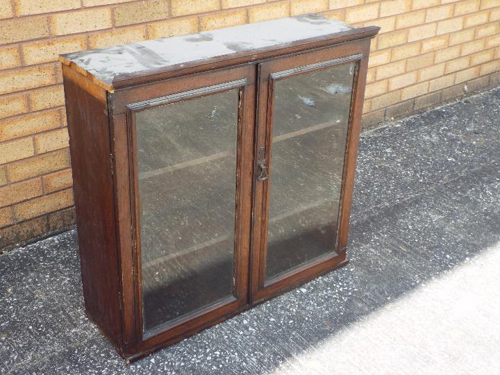 A wall mounted oak display cabinet, the twin glazed doors opening to reveal three internal shelves, - Image 2 of 3