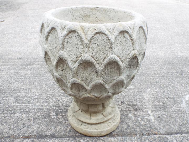 Garden Stoneware - A large reconstituted stone dahlia petal urn on hexagonal base.