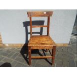 A Victorian oak hall chair